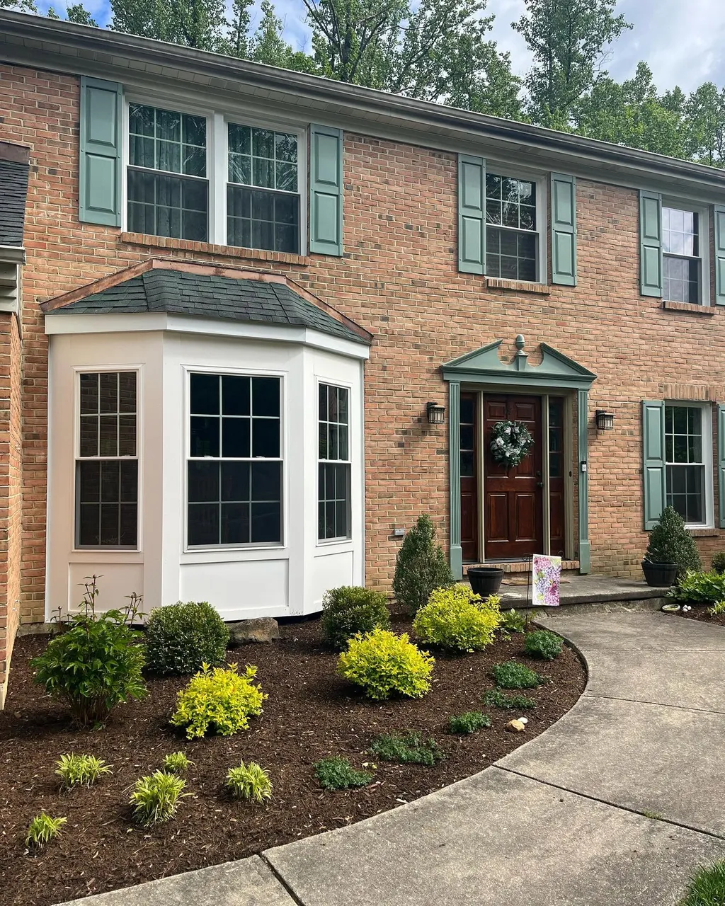 Brick home exterior renovated by Delpa Builders in New Castle, Delaware